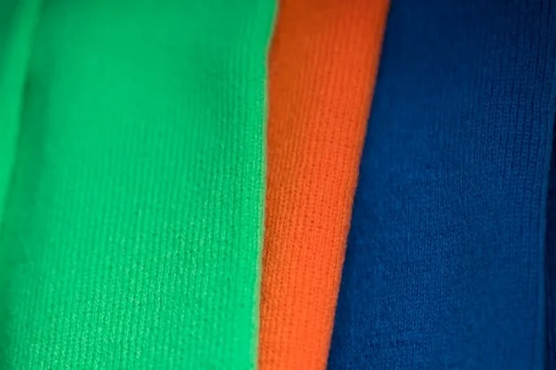 A close-up shot of a Premier League jersey made from recycled materials, showcasing the fabric's texture and highlighting the sustainable manufacturing process, with a focus on eco-friendly labels and insignias.