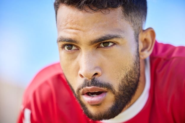 A close-up shot of an American soccer player in La Liga, highlighting their focused expression and team's jersey, symbolizing their commitment to the club and the challenges they face in a foreign league.