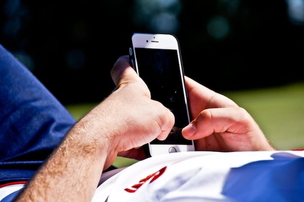 A close-up shot of a smartphone displaying a La Liga Instagram post featuring an American celebrity (e.g., a musician or actor) wearing a La Liga team jersey. The background shows an excited crowd at a La Liga event in the US.