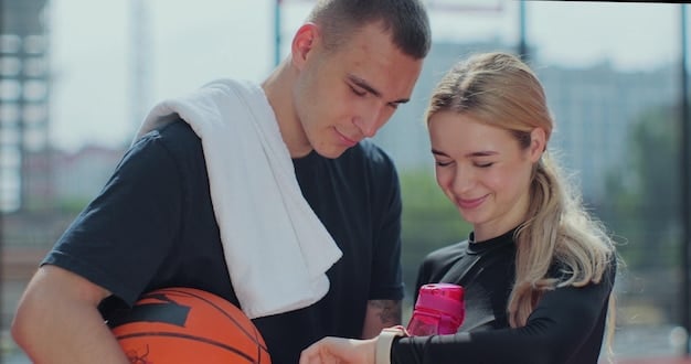 Close-up shot of a La Liga personal trainer monitoring a football player's heart rate and blood. The expert uses cutting-edge technology to tailor exercise to the athlete's specific condition, in a high-tech setting.