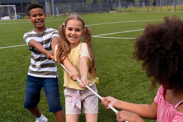 A diverse group of children participating in a soccer clinic on the field of an MLS stadium. Coaches are instructing them, and parents are watching from the stands, creating a sense of community and teamwork.