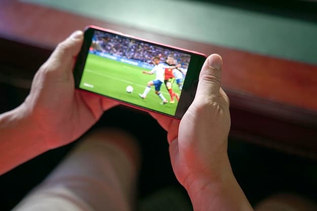 High-resolution close-up of a soccer fan using a mobile app at a live MLS game, focused on the interactive features and real-time updates displayed on the screen.