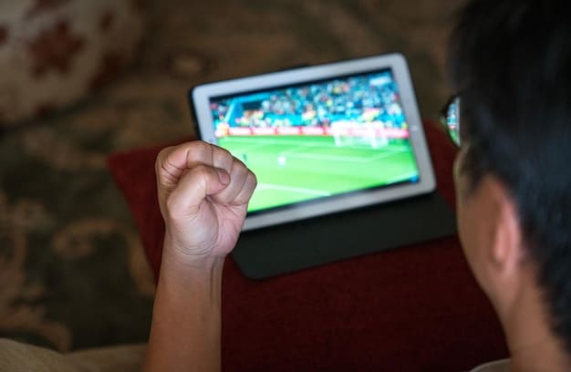 A close-up of a person using a tablet to stream a Champions League match, with the Paramount+ logo visible on the screen.