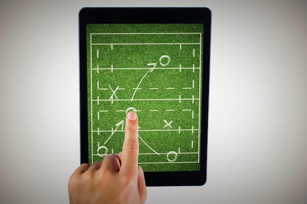 A close-up shot of a coach holding a tablet displaying a detailed heatmap of player movements during a match. The heatmap uses color gradients to indicate areas of high and low activity, providing insights into tactical positioning and player workloads. The coach is focused and intently studying the data.